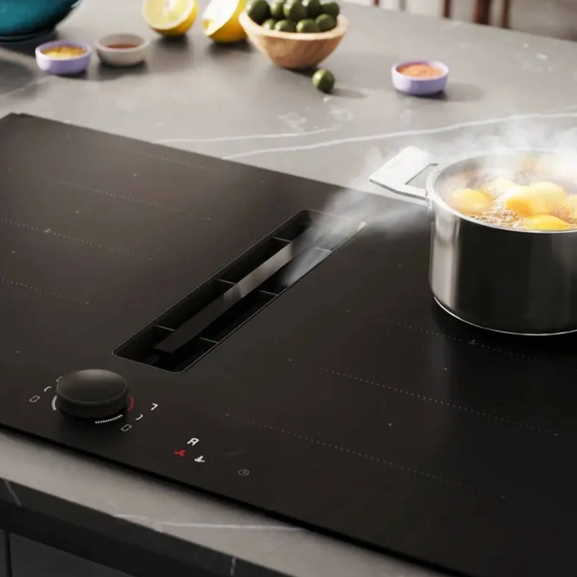 Neff Induktionskochfeld mit integriertem
Dunstabzug und Twist Pad Drehknopf in Matt Black